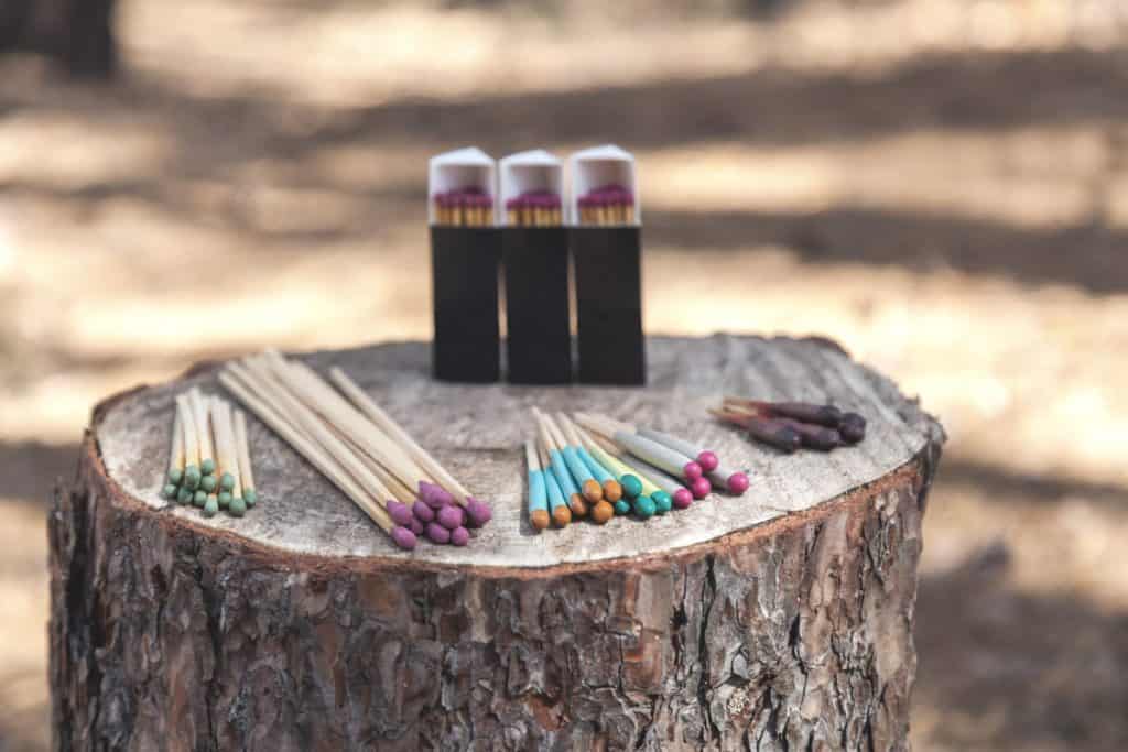 waterproof matches on tree stump in wilderness