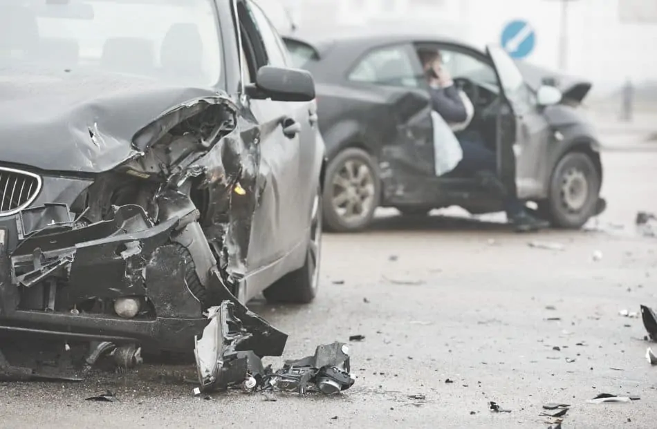 car crash on street with two cars