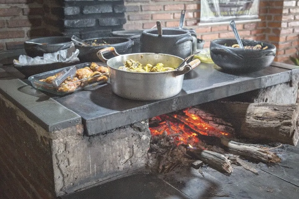 food cooking on a wood stove in the kitchen