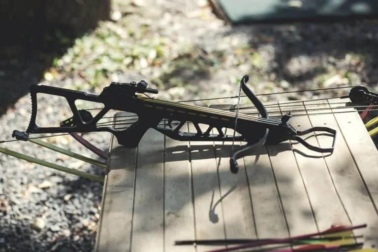 A crossbow pistol on a table outdoors