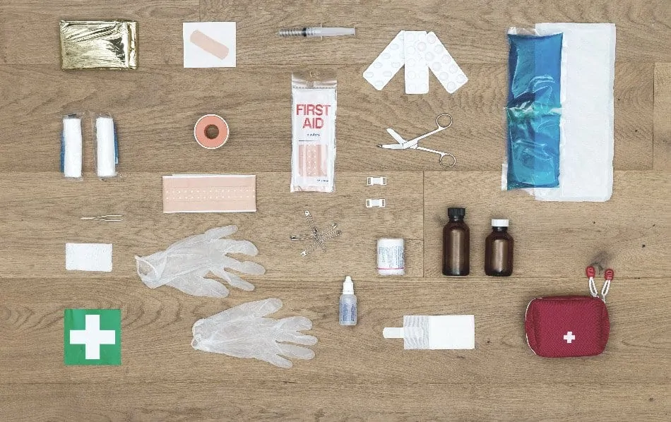 contents of first aid kit displayed on floor