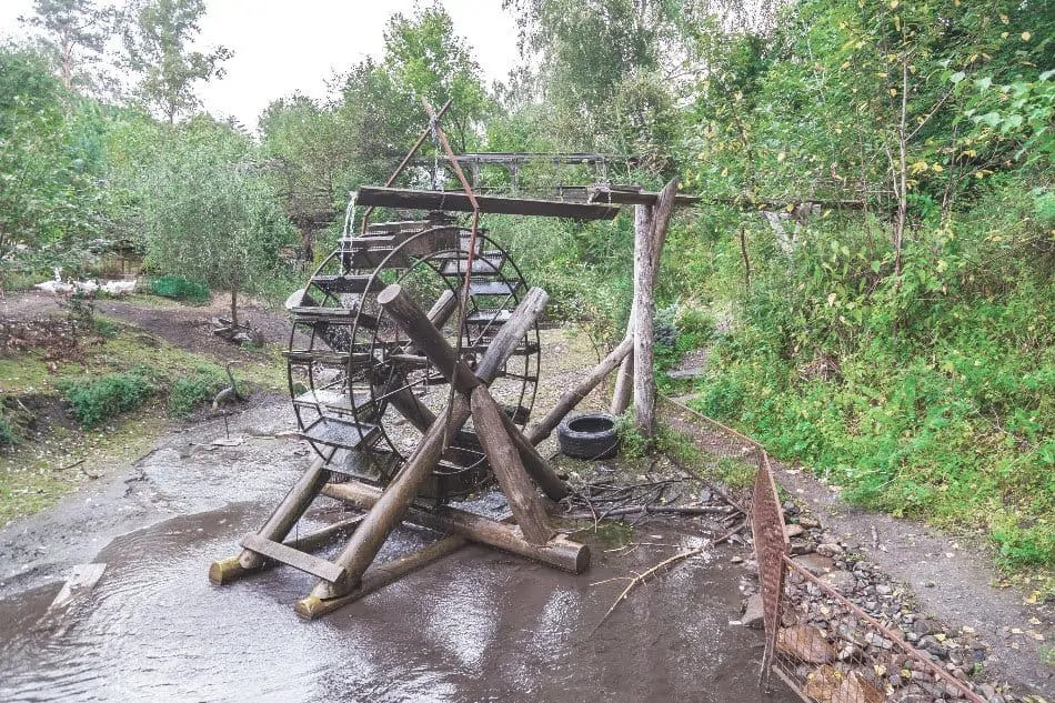 old retro water mill for generating electricity off grid