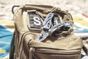 leatherman multi tool open and ready to use in a survival situation