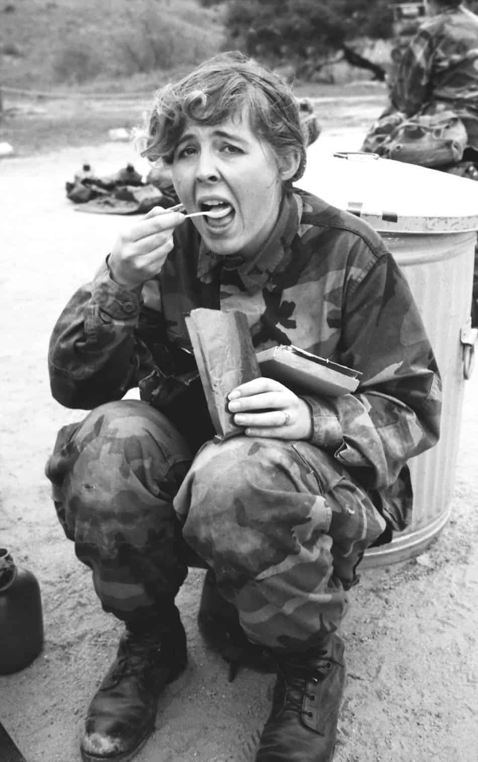 young woman marine finding her ration not to her liking while on a field exercise at camp pendleton