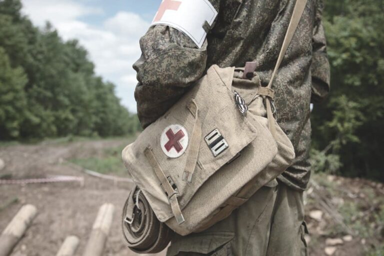 medical sling pack over shoulder of military medic person