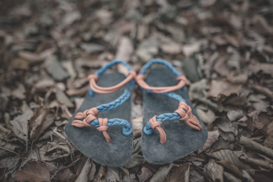 paracord thongs sitting on forest floor