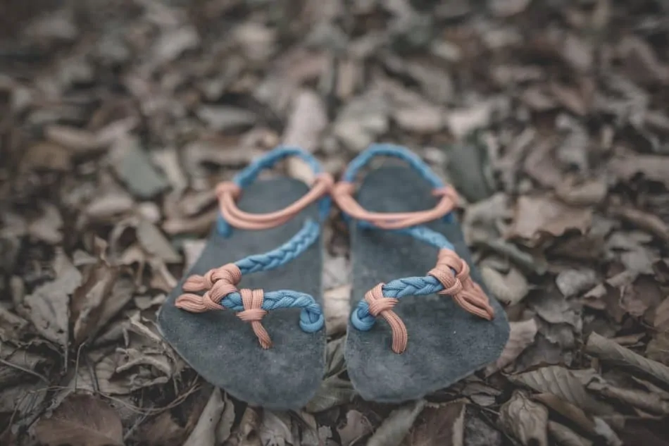 paracord thongs sitting on forest floor