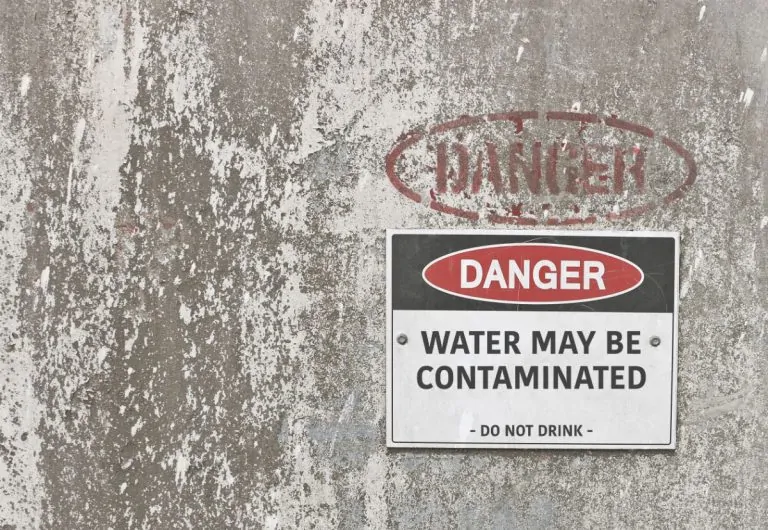 warning sign on wall telling you not to drink water as it may be contaminated