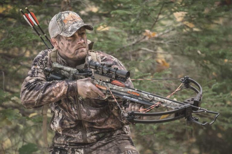 Hunting man in camo holding a wicked ridge invader g3 crossbow