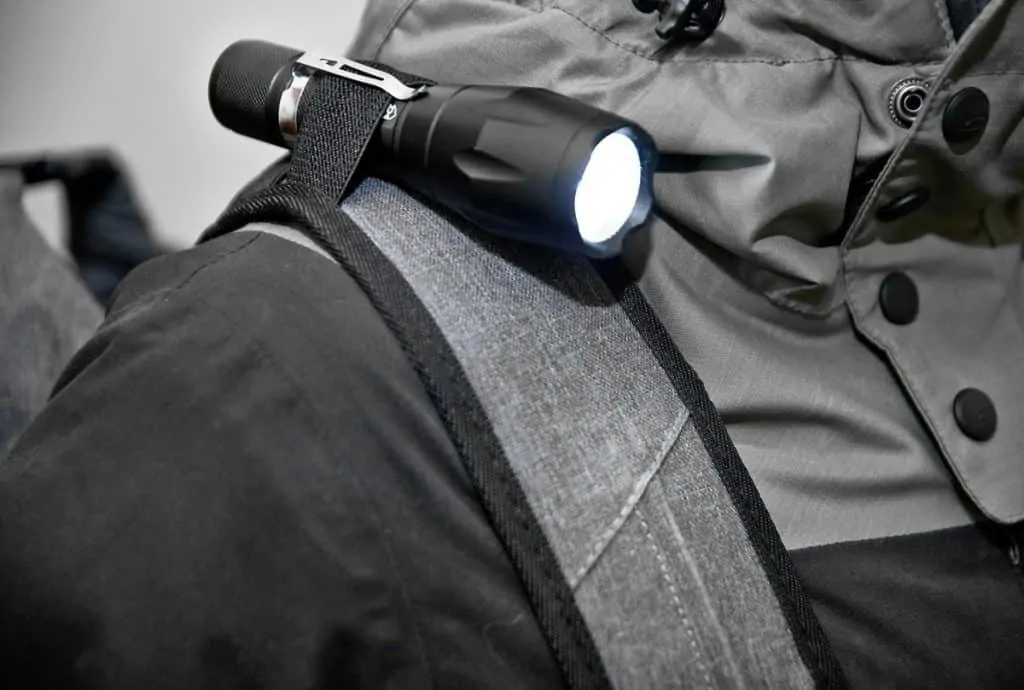 flashlight holder detail on seventy2 survival backpack strap