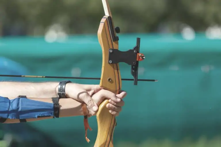 taking aim during an archery lesson for beginners