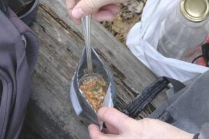 freeze dried food being eaten by backpacker