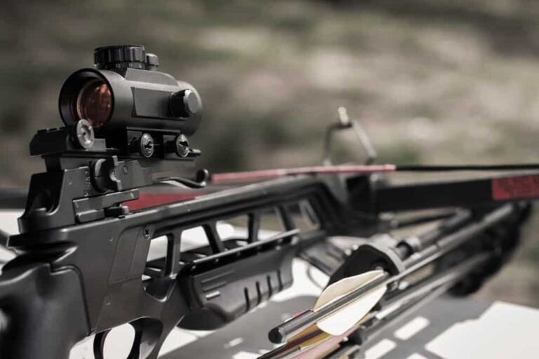 close up of 175 pound crossbow resting on range bench